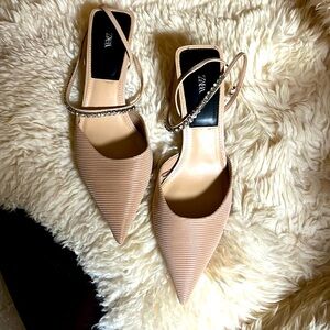 Beige color open back ,2 inches heel shoes . Used once, great condition !